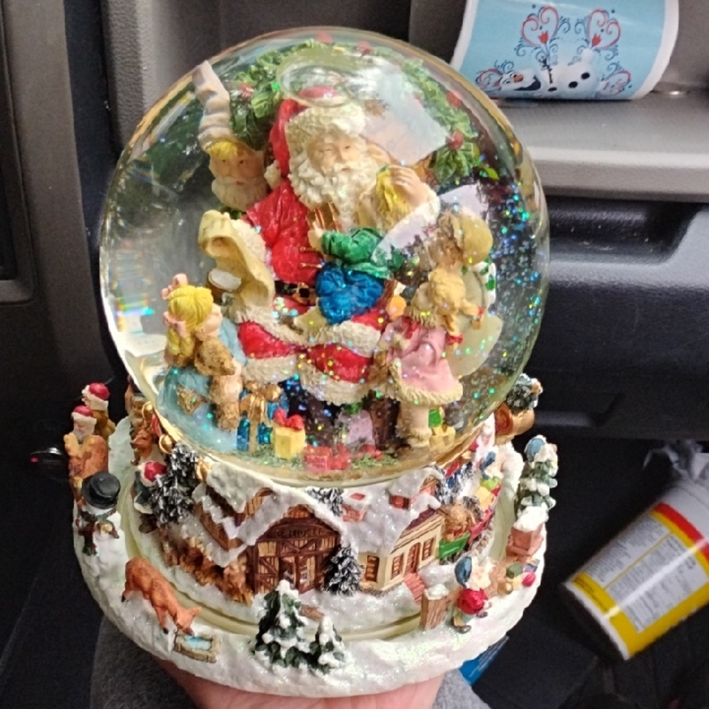 Festive Santa Snow Globe with Colorful Details